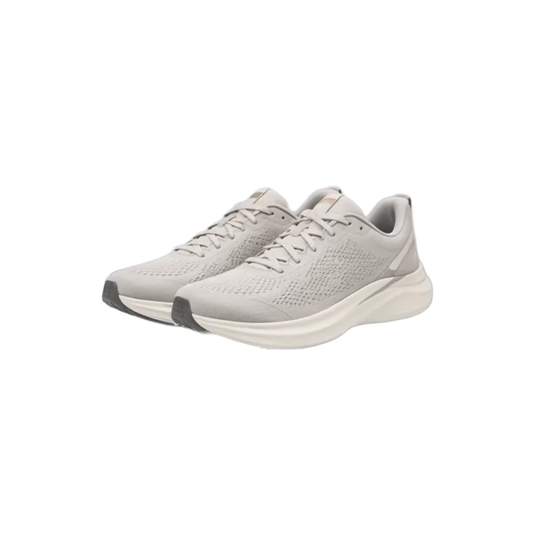 A pair of gray knit running shoes on a plain white background, the product photo as the store sends it